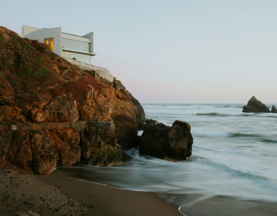 Modern house on a rocky cliff overlooking the ocean